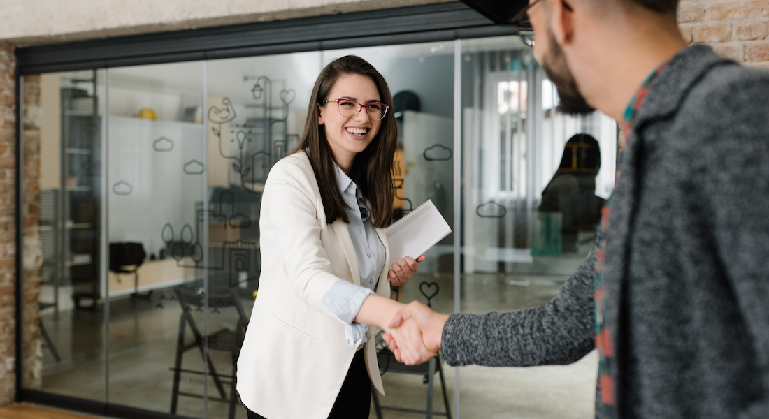 Woman and man shaking hands