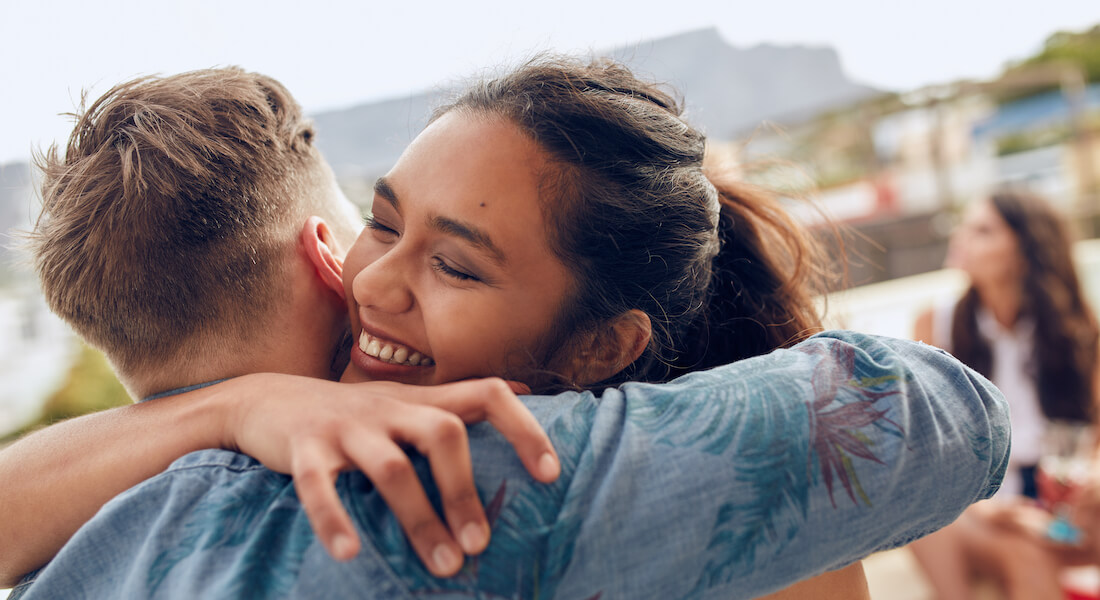 Woman and man hugs each other