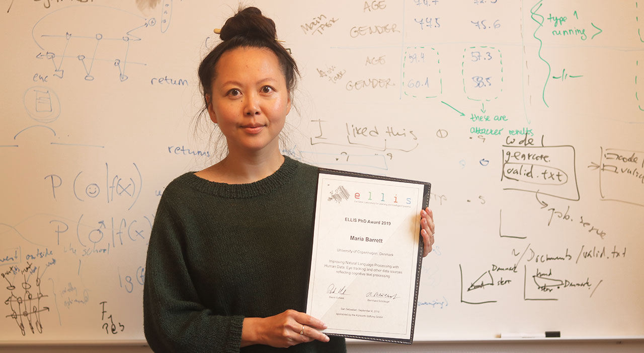 Maria Barrett with her ELLIS PhD Award 2018 diploma.
