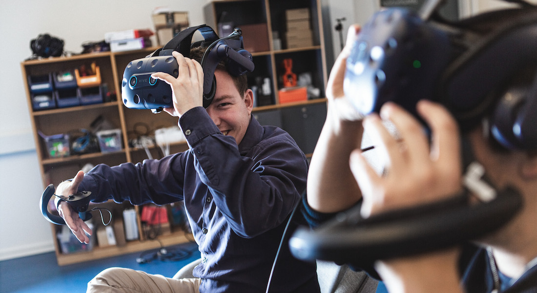 Guys playing with Virtual Reality