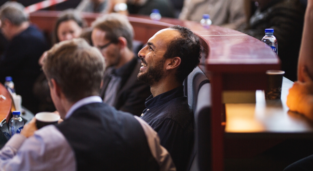 Man laughing in an audience